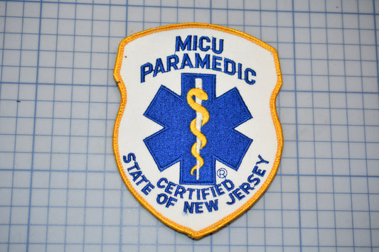 a patch with the text "MICU PARAMEDIC" and "STATE CERTIFIED OF NEW JERSEY" printed on it, along with a medical symbol.