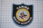 A black and blue patch with the text "CANINE DETECTION UNIT" and "NARCOTIC INTERVENTION" printed on it, along with a graphic of a dog's head.