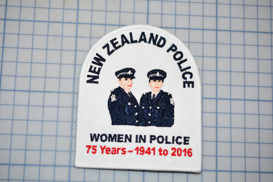 a patch with a graphic of two police officers, along with text that reads "NEW ZEALAND POLICE" and "WOMEN IN POLICE". The patch also includes the text "75 Years - 1941 to 2016".