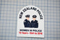 a patch with a graphic of two police officers, along with text that reads "NEW ZEALAND POLICE" and "WOMEN IN POLICE". The patch also includes the text "75 Years - 1941 to 2016".