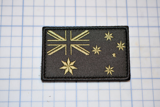 a black patch with gold stars on it