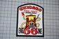 A patch with the text "CHICAGO FIRE DEPT. 'RIVER RATS'" and an illustration of a fire hydrant with a yellow hose. The patch also features the number "56" and the text "ENGIN 36".