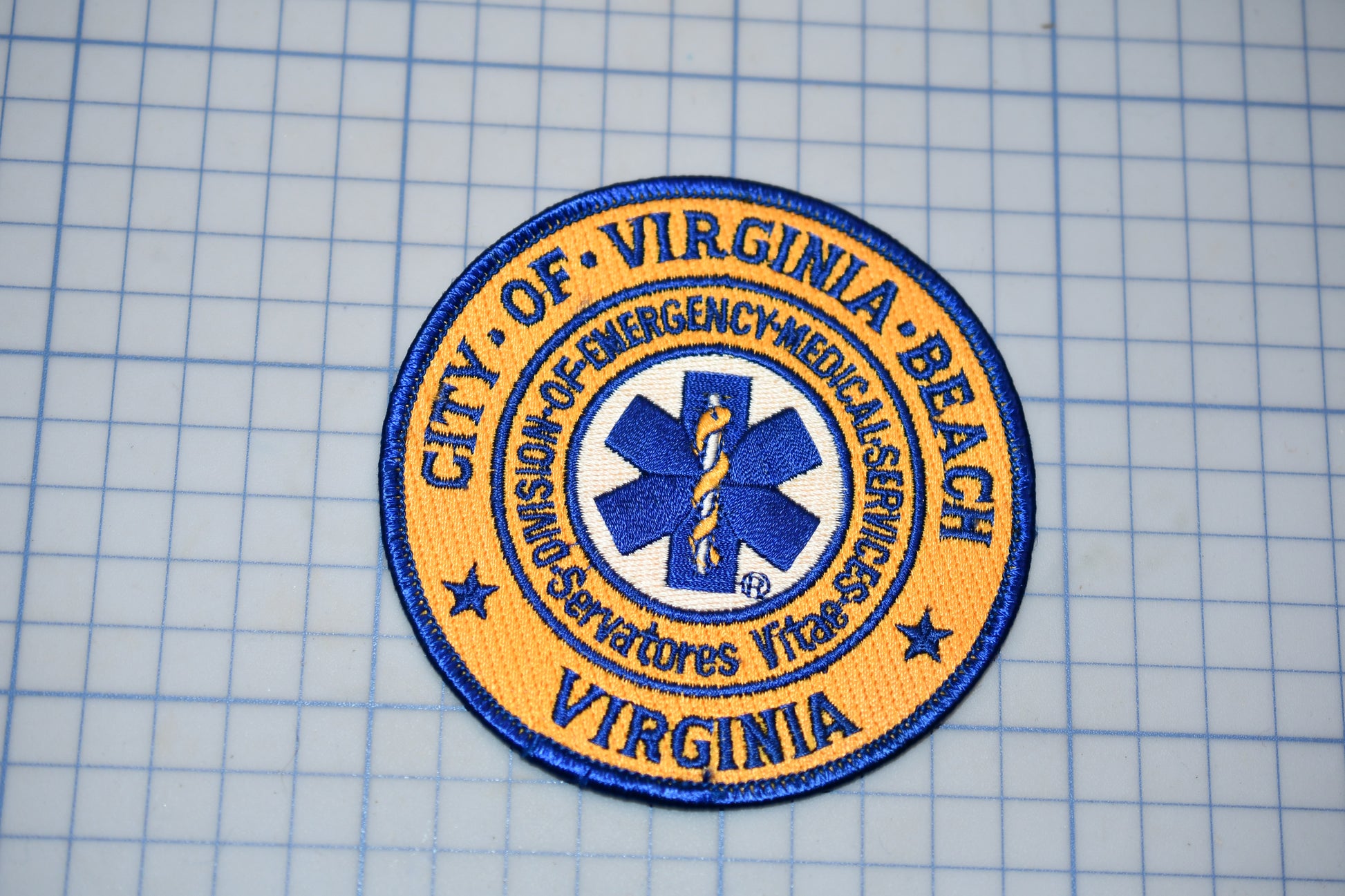 a patch with the text "CITY OF VIRGINIA BEACH" and a medical symbol, indicating that it is a patch from the City of Virginia Beach's emergency medical services.