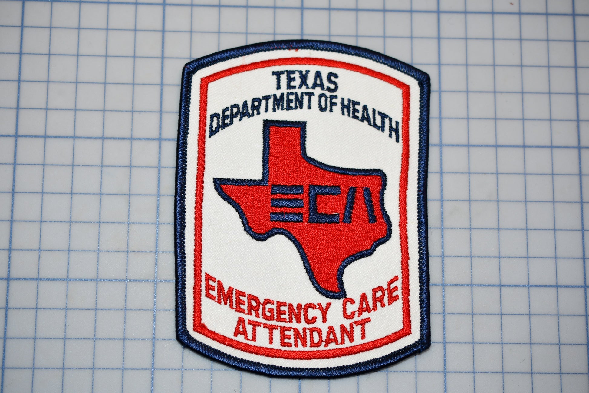 a Texas Department of Health Emergency Care Attendant patch.