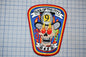 a colorful patch with a skull and flames, representing the "Soul of the City" fire department.