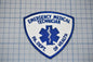 a blue and white emergency medical technician patch with the text "EMERGENCY MEDICAL TECHNICIAN" and "PA. DEPT. OF HEALTH" printed on it.