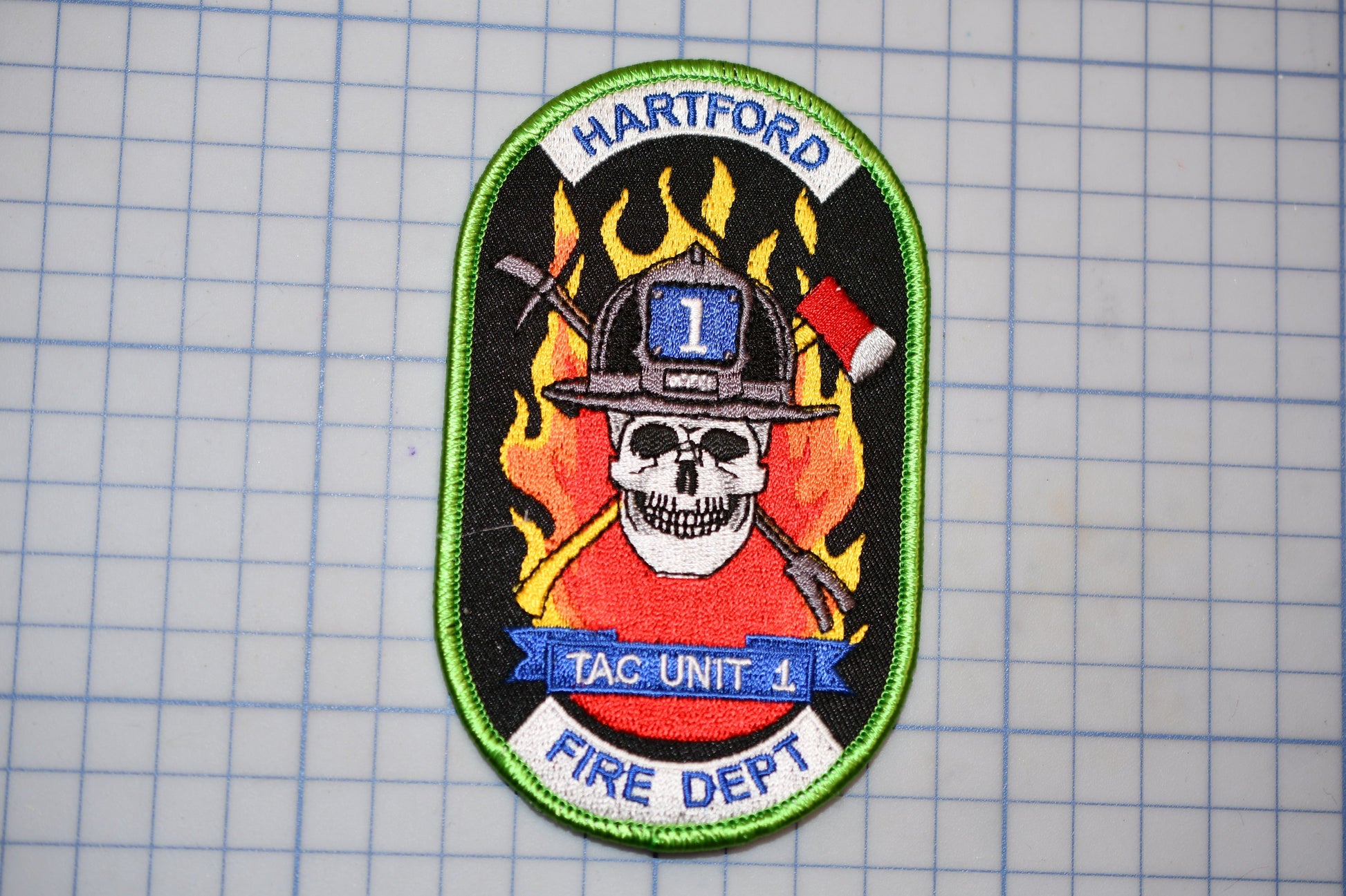 a patch with a firefighter's helmet and a skull, representing the fire department of Hartford.