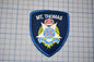 a blue patch with a crown on top of it