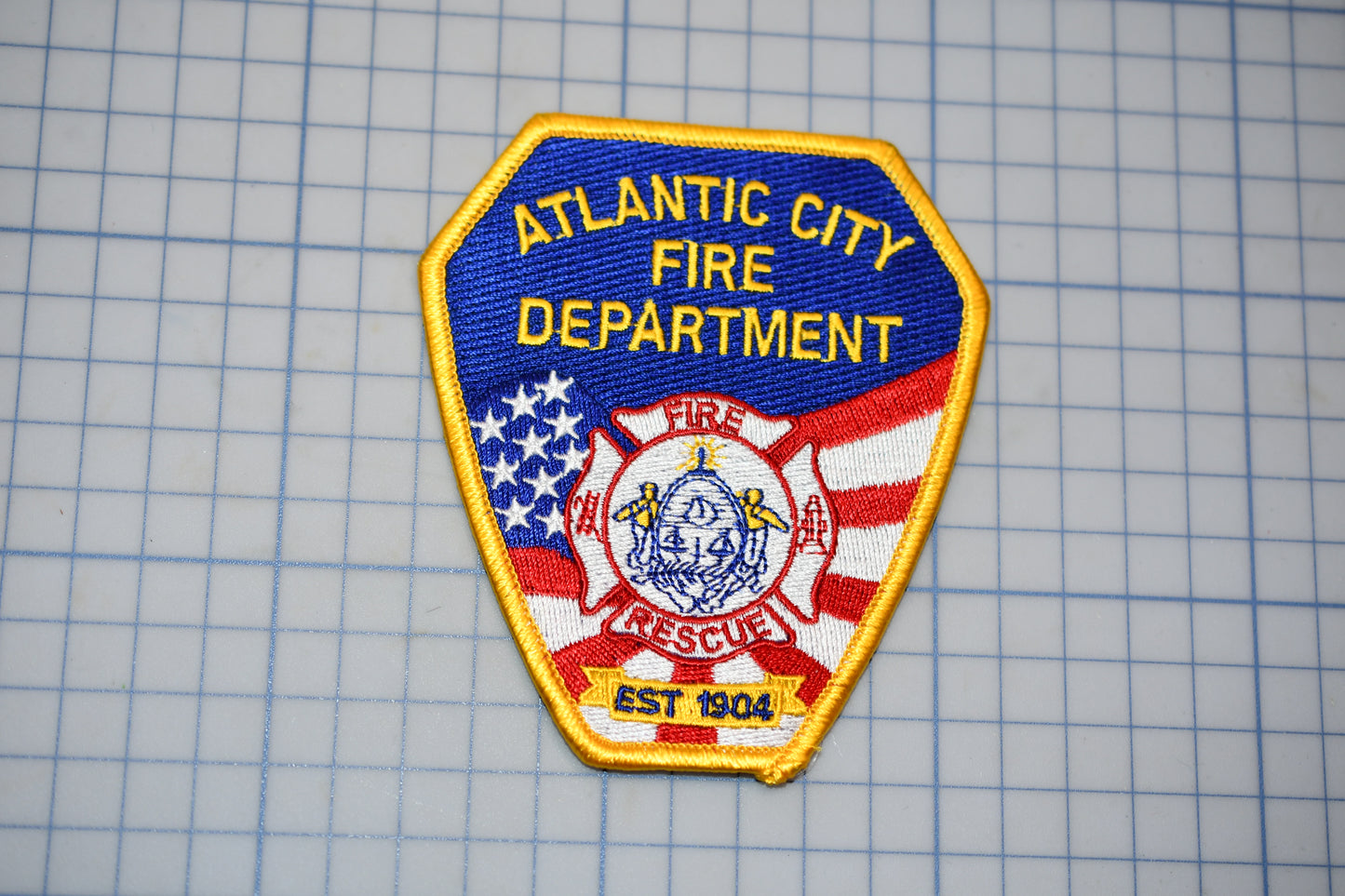 the atlantic city fire department patch is on a piece of paper