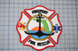 a fire rescue patch with a red and white color scheme, displaying various symbols and text related to the Freeport Fire Department.