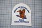 a police air support unit patch with an eagle, specifically an Auckland police eagle, as the main design element.