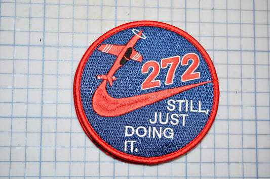 a red and blue patch with a picture of a nike logo