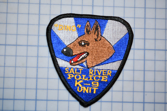 A police dog patch with the text "DINO" and "SALI RIVER POLICE K-9 UNIT" on it.
