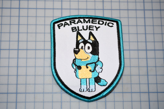 a patch with a dog on it that says paramedic bluey