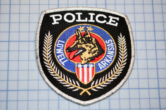 A police patch with a dog's head and the word "POLICE" prominently displayed.