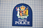 a blue patch with a coat of arms and text, representing the New Zealand Traffic Police.