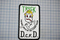a patch with a cartoon character wearing a fire helmet and holding a fire hose. The patch has text that reads "Truck 10" and "The Bad Boys of the 7th Battalion".