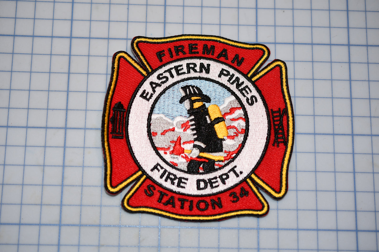 a fireman badge on a cutting board