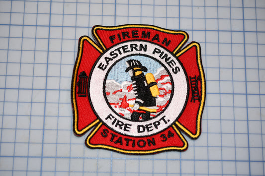 a fireman badge on a cutting board