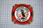 a fireman badge on a cutting board