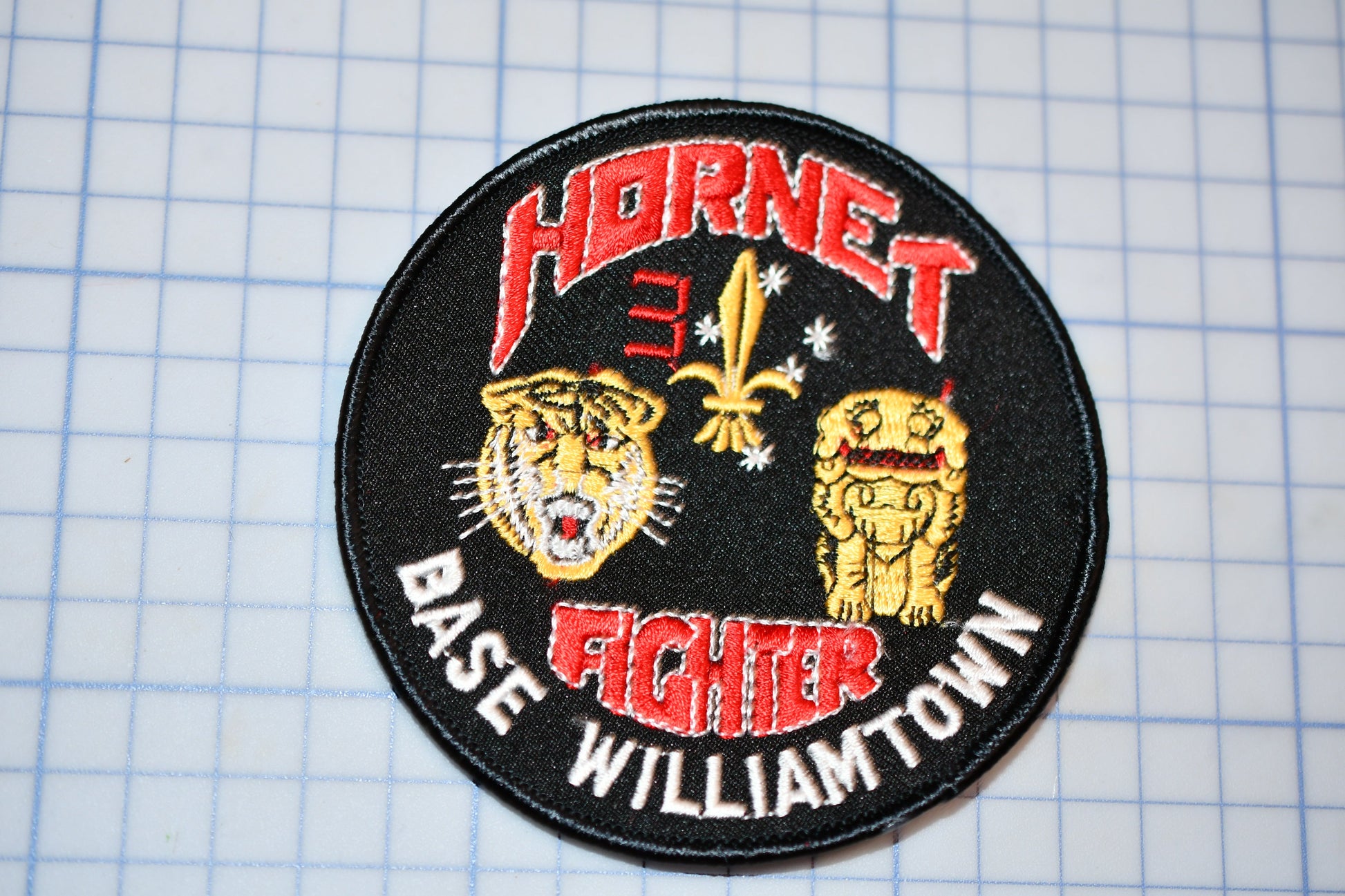 a patch with a picture of two tigers on it