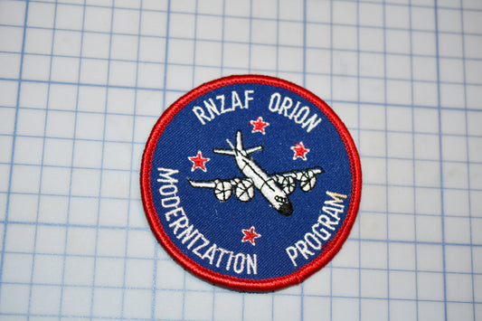 a blue and red patch with an airplane on it