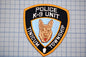 a police K-9 unit patch with a dog's head and the text "Police K-9 Unit" and "Township" on it.