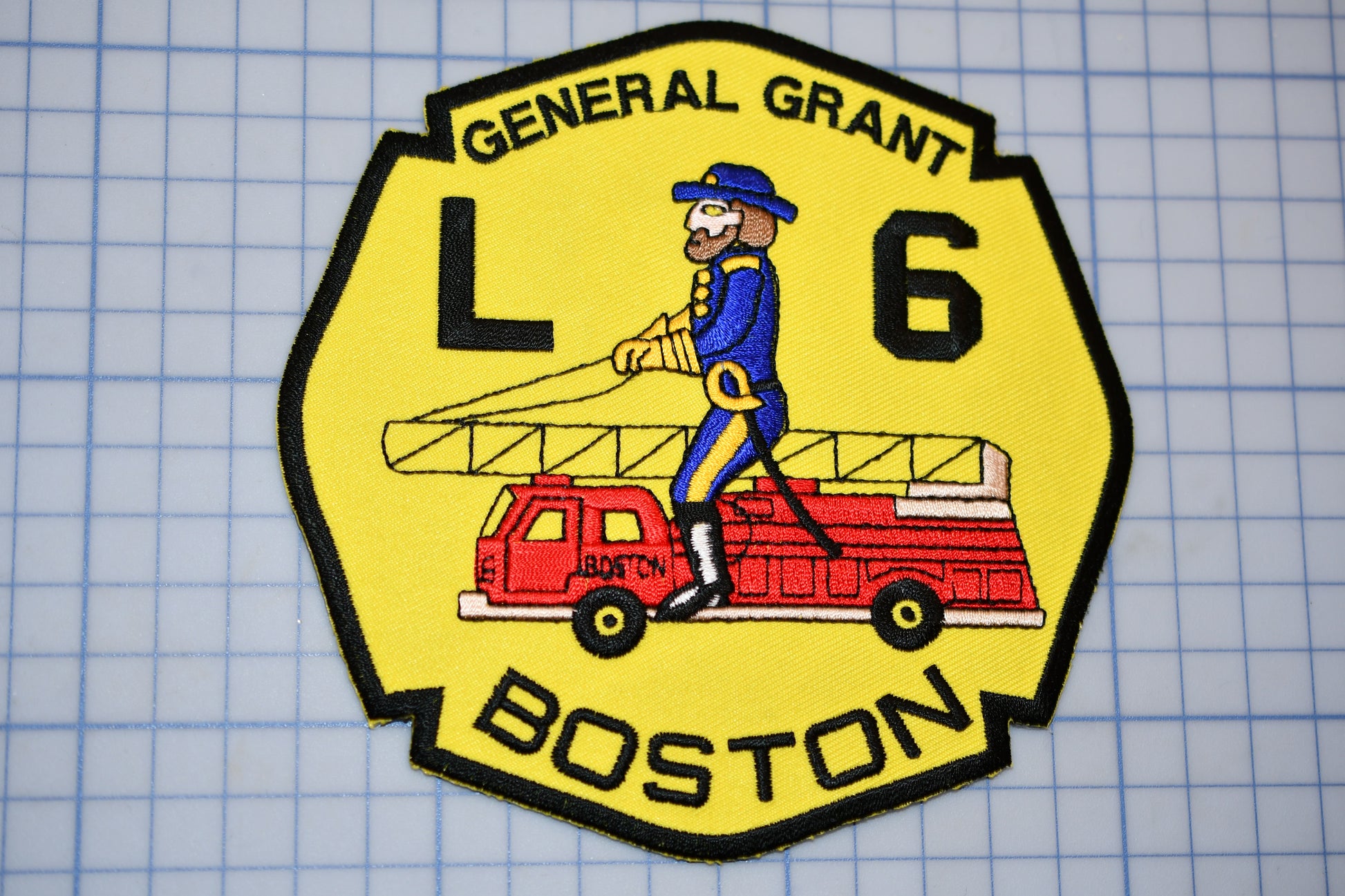 a patch with a picture of a man on a truck