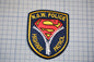 a police patch with a Superman logo, indicating that it is a Highway Patrol police patch.