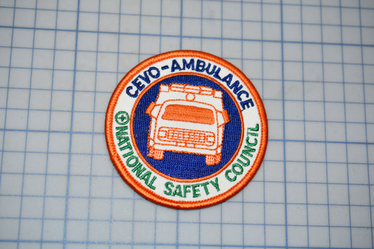 a patch with the text "CEVO-AMBULANCE" and "NATIONAL SAFETY COUNCIL" printed on it, along with an image of an ambulance.