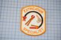 a patch with the text "EXTRICATION SPECIALIST" and various tools, such as a wrench and pliers, arranged around a central figure.