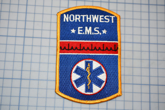 a patch with the text "NORTHWEST EMS" and a medical symbol, likely representing the Northwest Emergency Medical Services (EMS) of the United States.