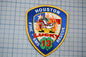 A patch with the text "HOSTON FIRE & EMERGENCY RESCUE" and an image of a firefighter, along with the number "13".