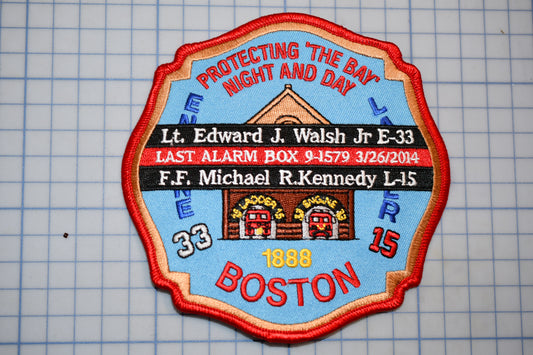 A patch with a fire department emblem, featuring a fire engine, a building, and text that reads "Protecting the Bay Night and Day".