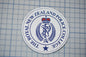 a circular badge with the text "THE ROYAL NEW ZEALAND POLICE COLLEGE" printed on it.