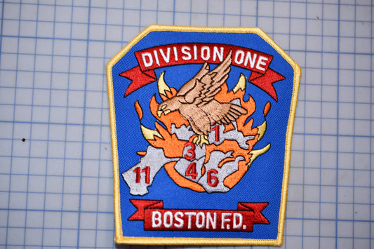 a fire department patch with a bird, flames, and the text "Division One" and "Boston Fire".