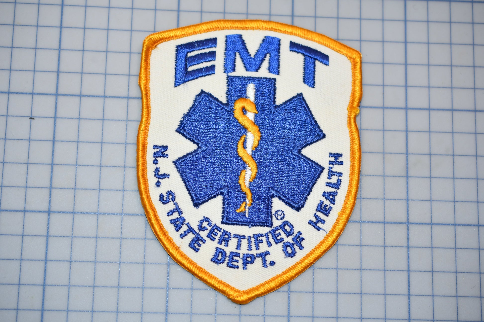 a New Jersey State Certified Health Emergency Medical Technician (EMT) patch.