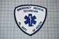 a medical emergency technician patch with a blue and white design.