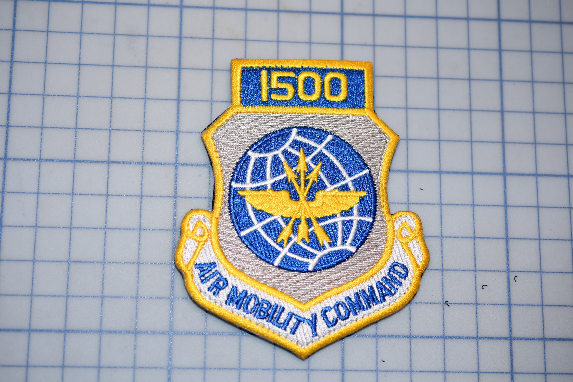 a military patch with the number "1500" and the words "AIR MOBILITY COMMAND" on it.