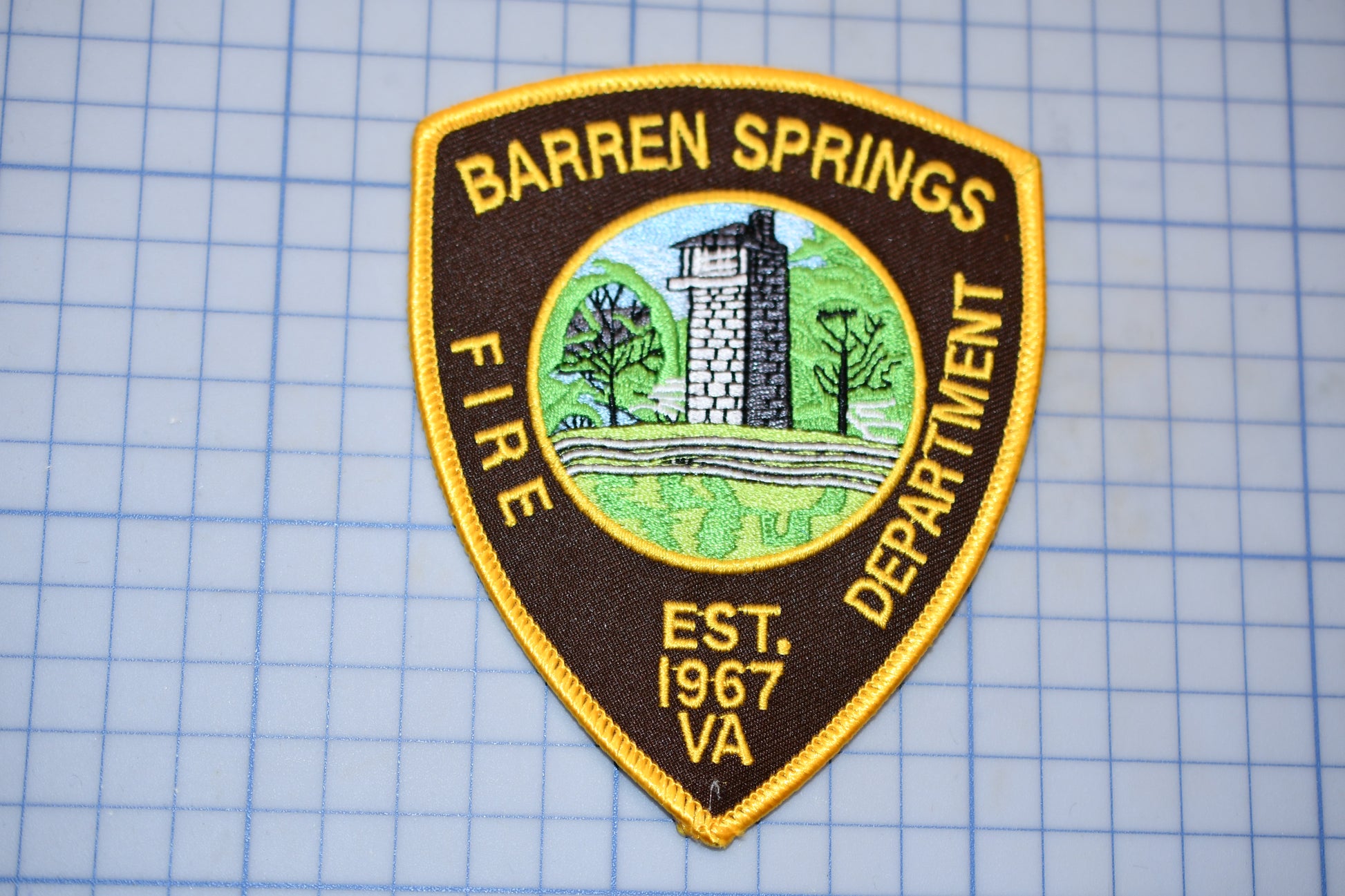 a badge on a piece of paper that says barren springs fire department