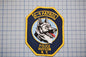 A police K-9 patrol badge with the text "K-9 PATROL" and "POLICE HUDSON N.Y."