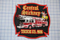 a patch with a fire truck on it
