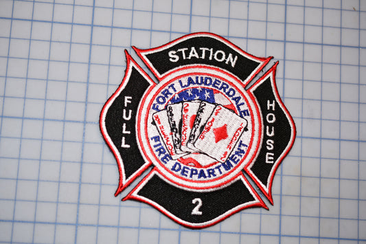 a fire department patch with a cross design and the words "Fort Lauderdale Fire Department 2" written on it.