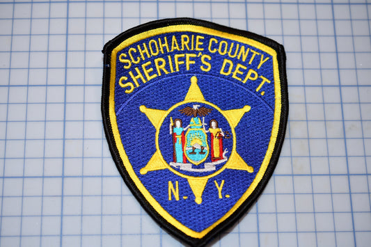 a blue and yellow patch with the words schroaie county sheriff&#39;s