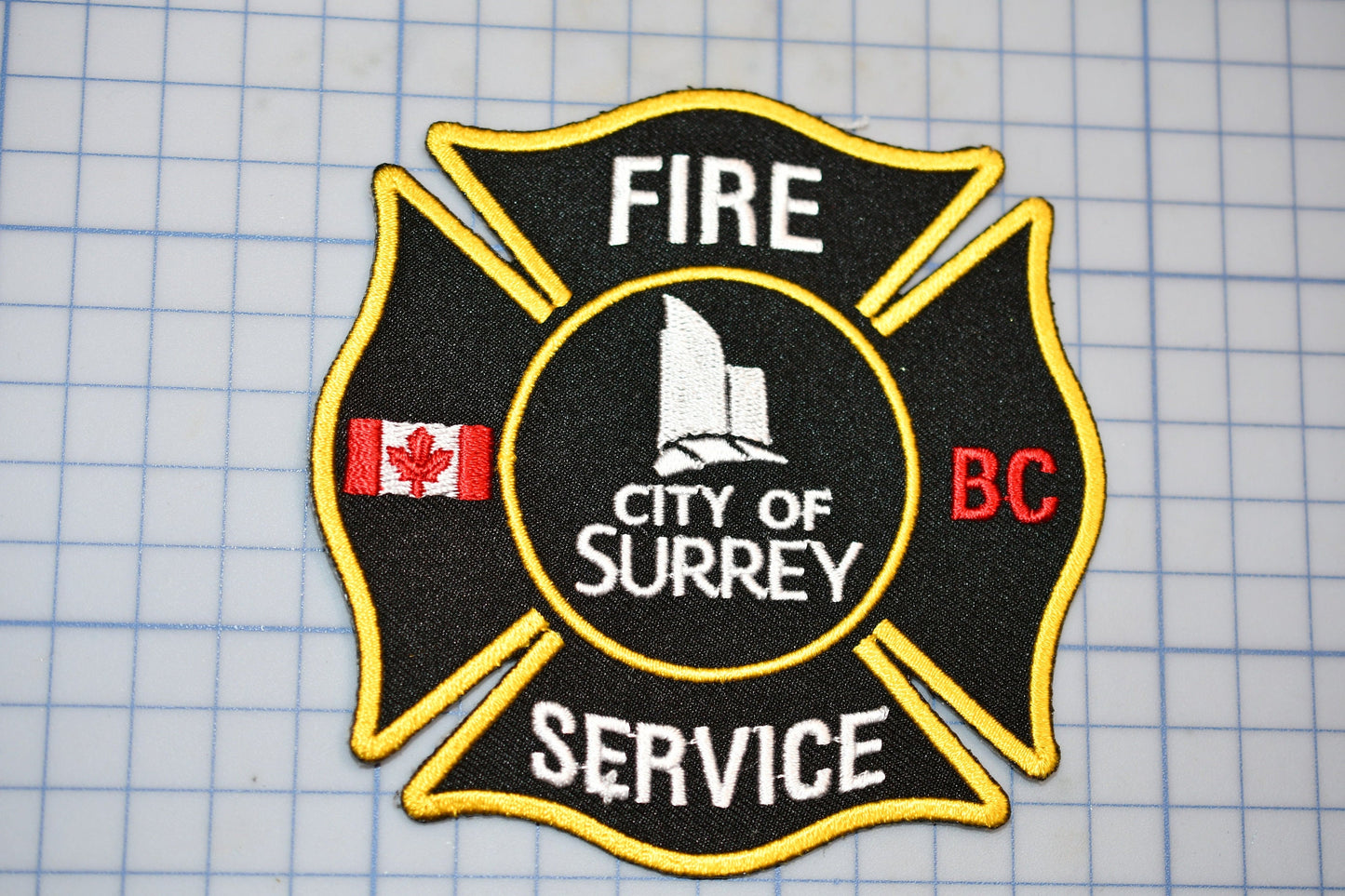 a fire department patch on a cutting board