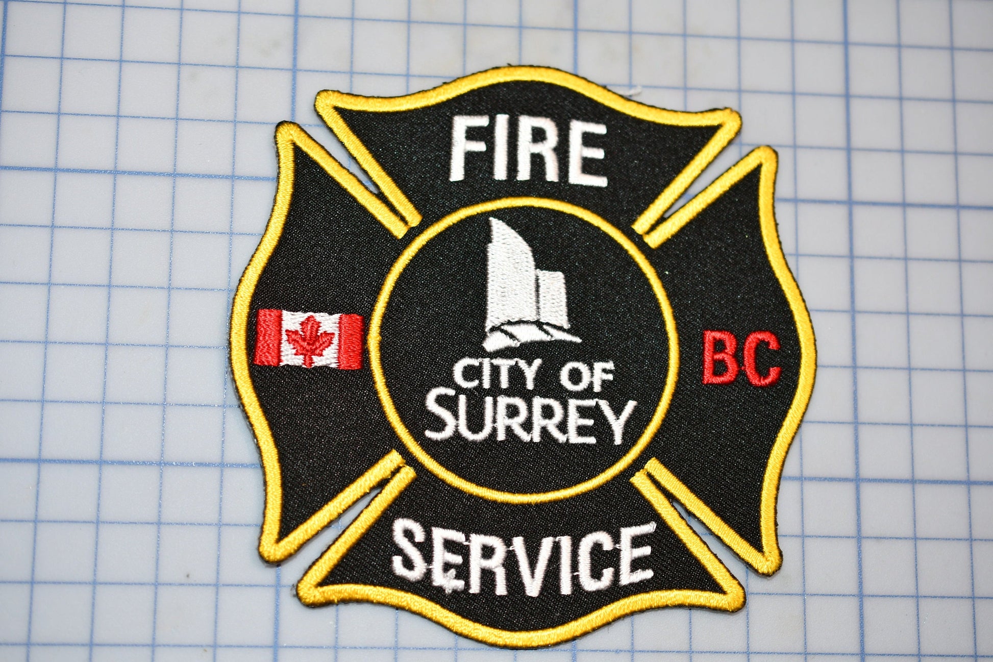 a fire department patch on a cutting board
