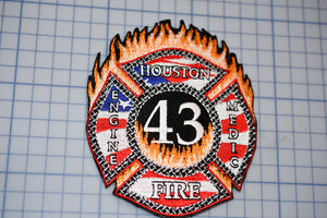 a fire department patch with the number 43 on it