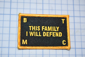 a patch that says, this family i will defend m c