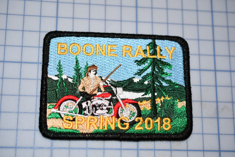 a patch with a picture of a man on a motorcycle
