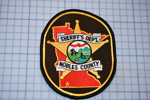 a patch with a sheriff's dept badge on it